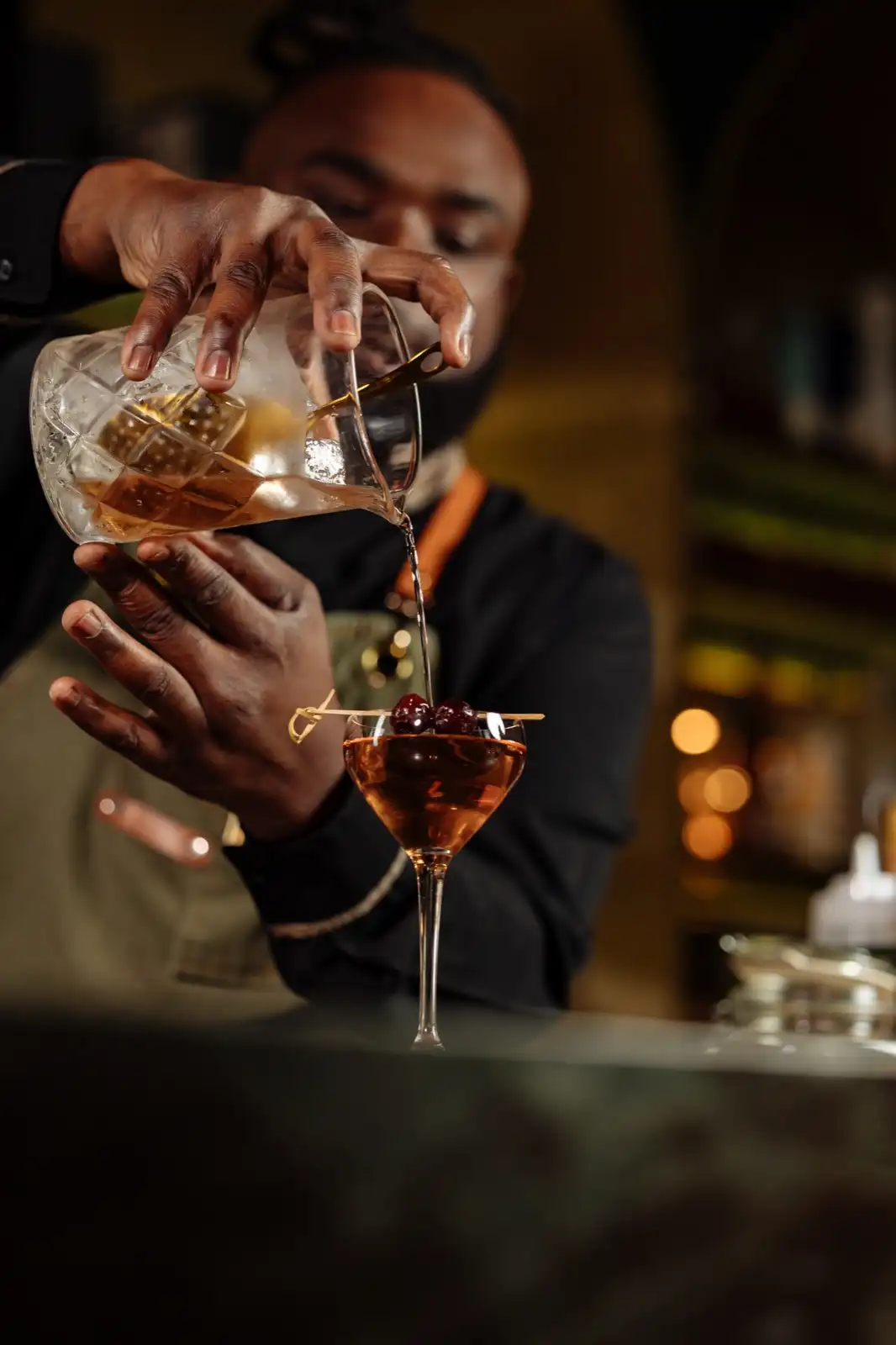 Bartender pouring drink at Horse To Water Baha Mar